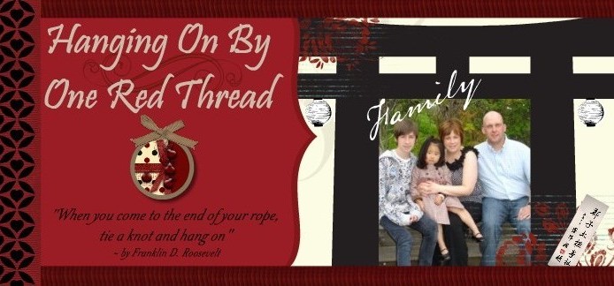 Hanging on by one red thread