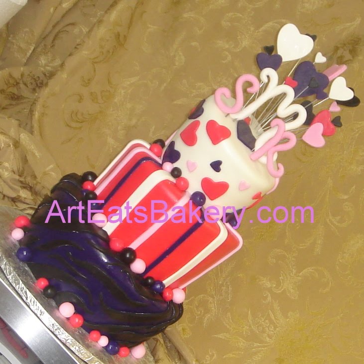 birthday cake pink and black. Three tier topsy turvy pink,