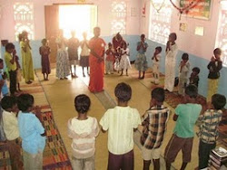 Orphan children praying