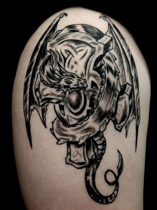 This was my first tattoo I had done by the talented Amigo Lartis from England! Cross Dragon Tattoo Pictures.