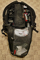 a bag with a camera and other equipment