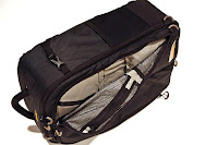 a black and tan bag with zipper