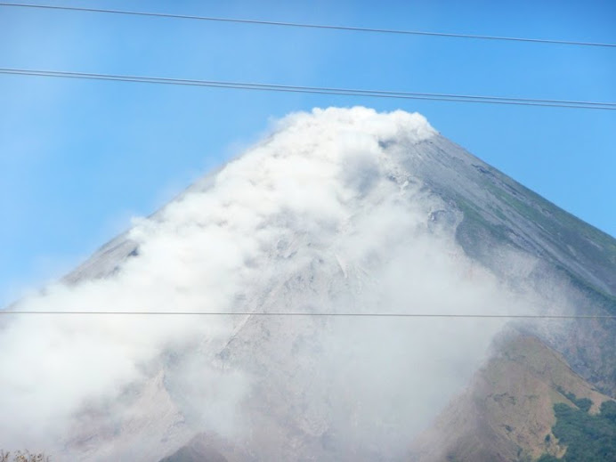 Close up--hard to tell smoke from steam from ash.