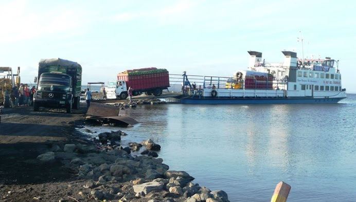 Loading plantain trucks onto the new ferry