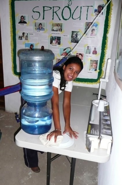 Jeysy helping clean the school.