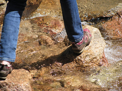 walking on rocks in a riverbed