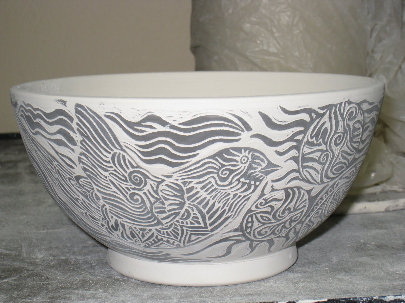 Randi Martin Kish/Ceramics Carving designs into cups using underglazes...