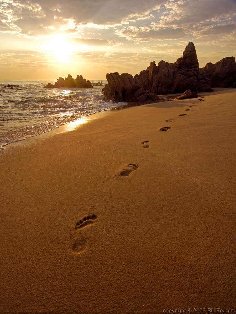 [footprints-sand-beach-sunrise.jpg]