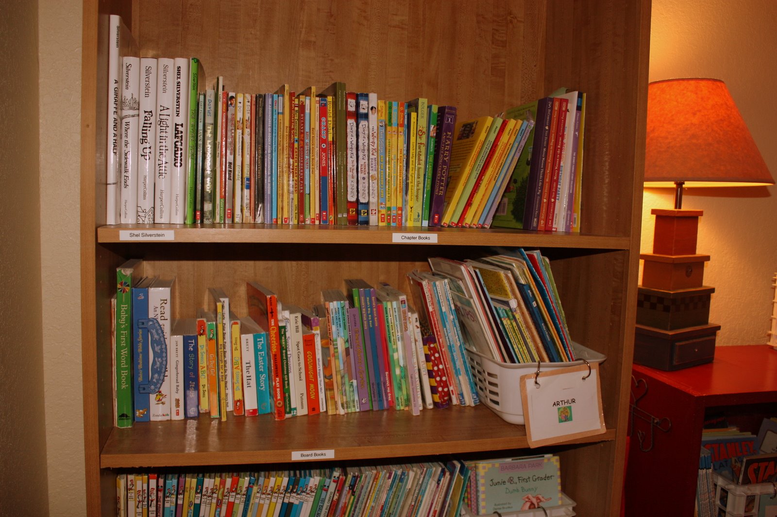 Image result for picture of kid putting books on a shelf