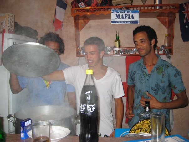 Cooking a lambs head in our hostel