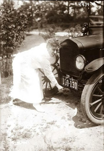 Ada Jones crank starting her Model T Ford, 1919