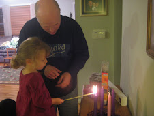 Lighting the Advent candle with Daddy