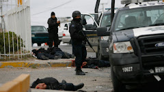 Mex police ambushed by cartel gangs