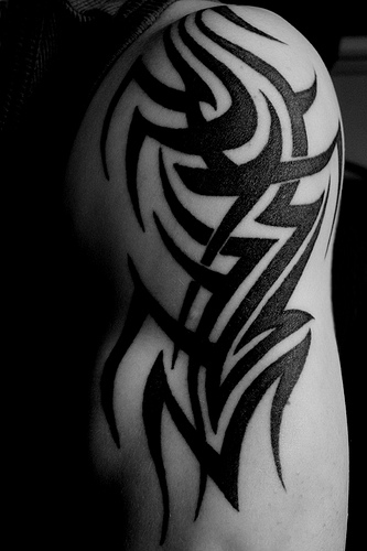 tattoos arm tribal. Tribal Arm And Shoulder Tattoo