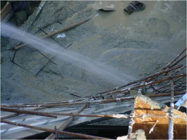 [Hose+stream+liquifies+and+moves+wet+concrete.jpg]