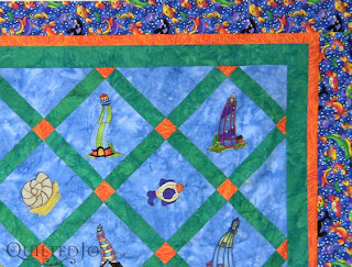 Fay's Lighthouse & Fish Embroidery Quilt, quilted by Angela Huffman