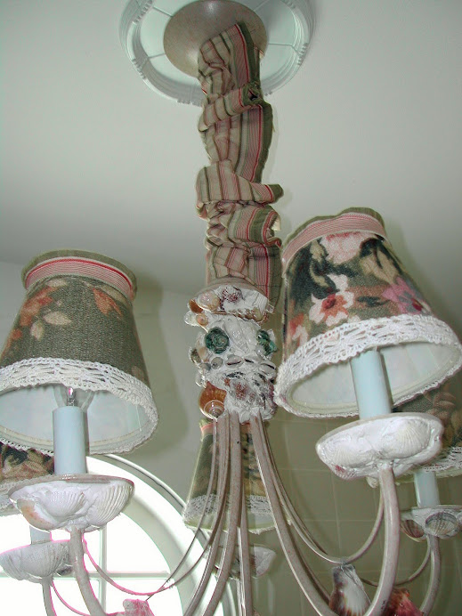 Putty and glue were used to attach the shells to the chandelier