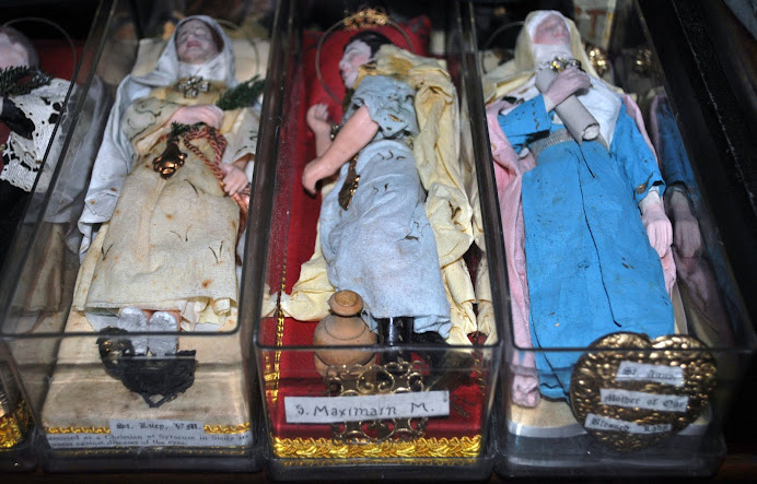 wax saint dolls
