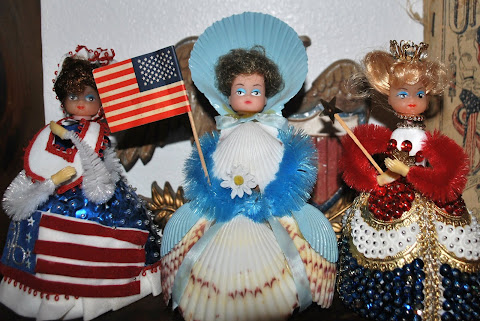 A trio of handmade patriotic dolls
