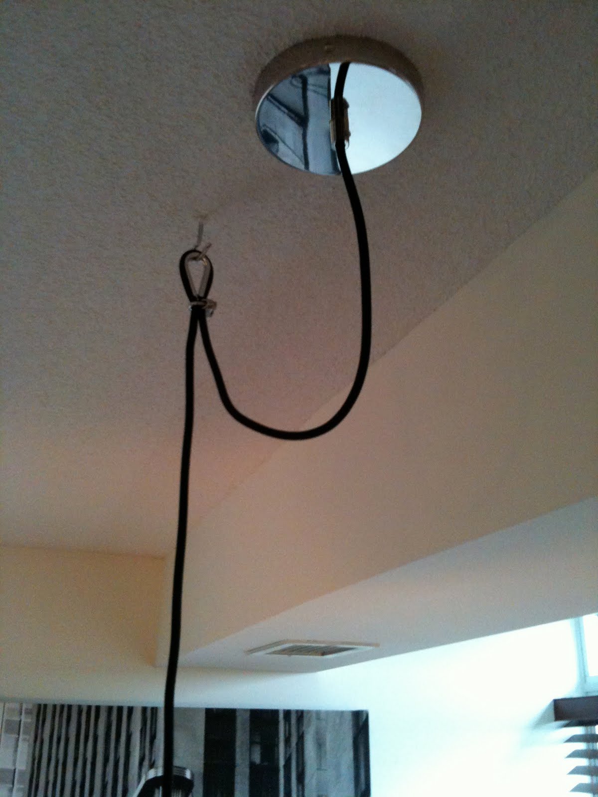 Swag A Pendant Light From Concrete Ceiling In A Condo Tower