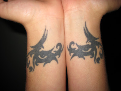 Two Tribal Eyes Tattoo