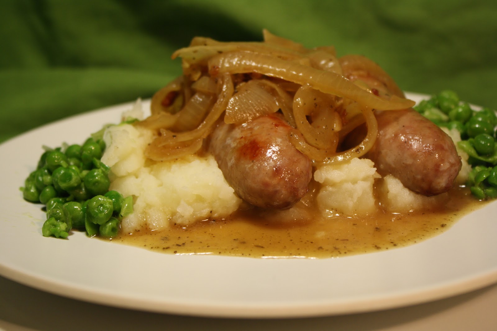 Bangers & Mash with Onion Gravy and Mushy Peas The Carnivore and the