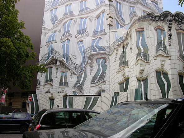 This surreal building actually exists at 39 Avenue George V, Paris.