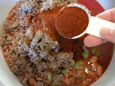 Add chili powder to the crock pot.