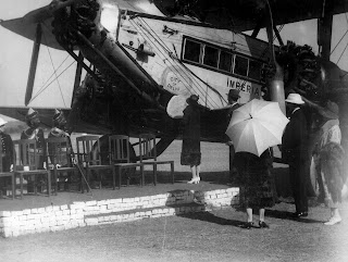First air service to India. Lady Hoare christens aircraft First flight to India, Lady Hoare in shot