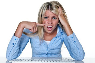 Why wouldn't you have that basic press info on your website?! (Photo: istock/Stock Photo NYC) Confused girl on computer