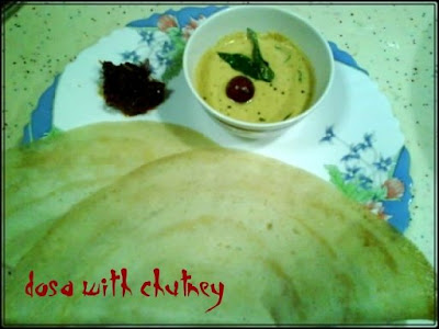 Enjoy the dosa and chutney with ginger pickle.