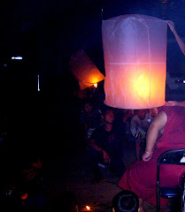 monk heating air inside lantern