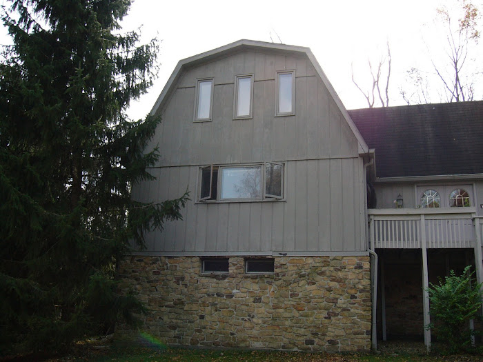 "Before" photo of a BEE Window Fiber Cement Siding job as well as a "Before" window replacement.