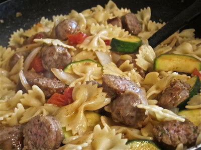 This Bow Tie Pasta with Italian Sausage and Vegetables recipe is a delicious and colorful dish bursting with rich flavor. You won't believe how simple it is! #WomenLivingWell #easydinners #bowtiepasta #italiansausage