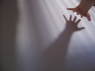 abstract outstretched hand and shadow