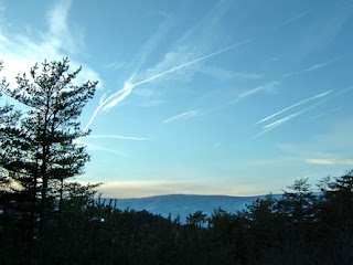 vapor trails over mountain