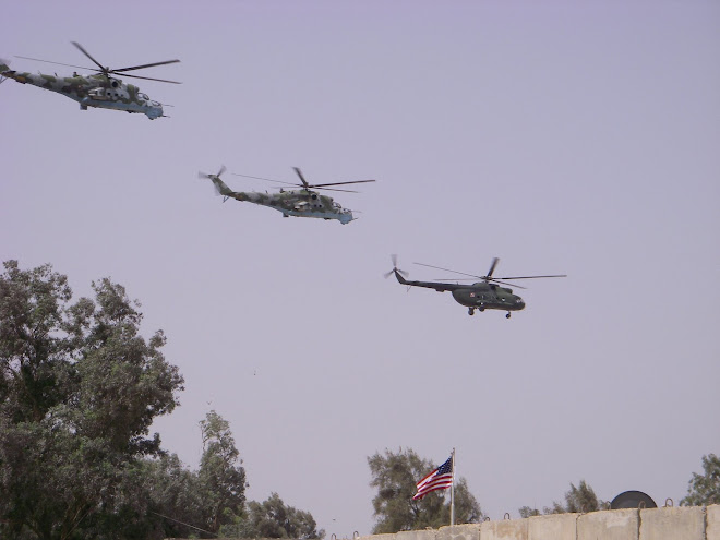 A bigger shot of the helicopters over old glory