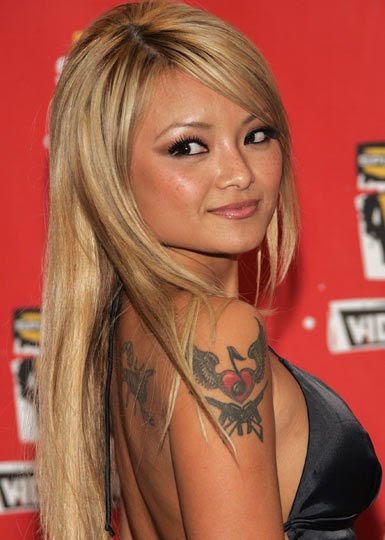 Tila Tequila Celebrity Tattoo Tattoo in Chinese means “to puncture the body...