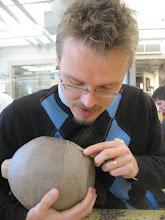 Carving a leatherhard pot