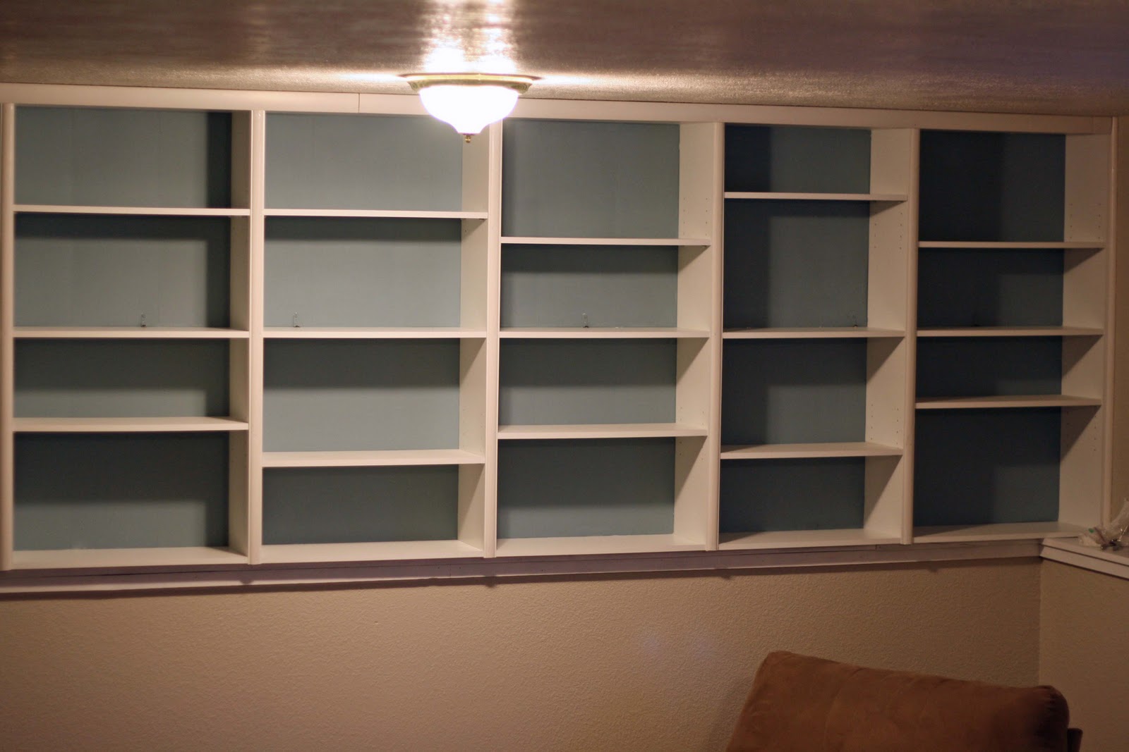 Running With Scissors Painting Backing of Shelves