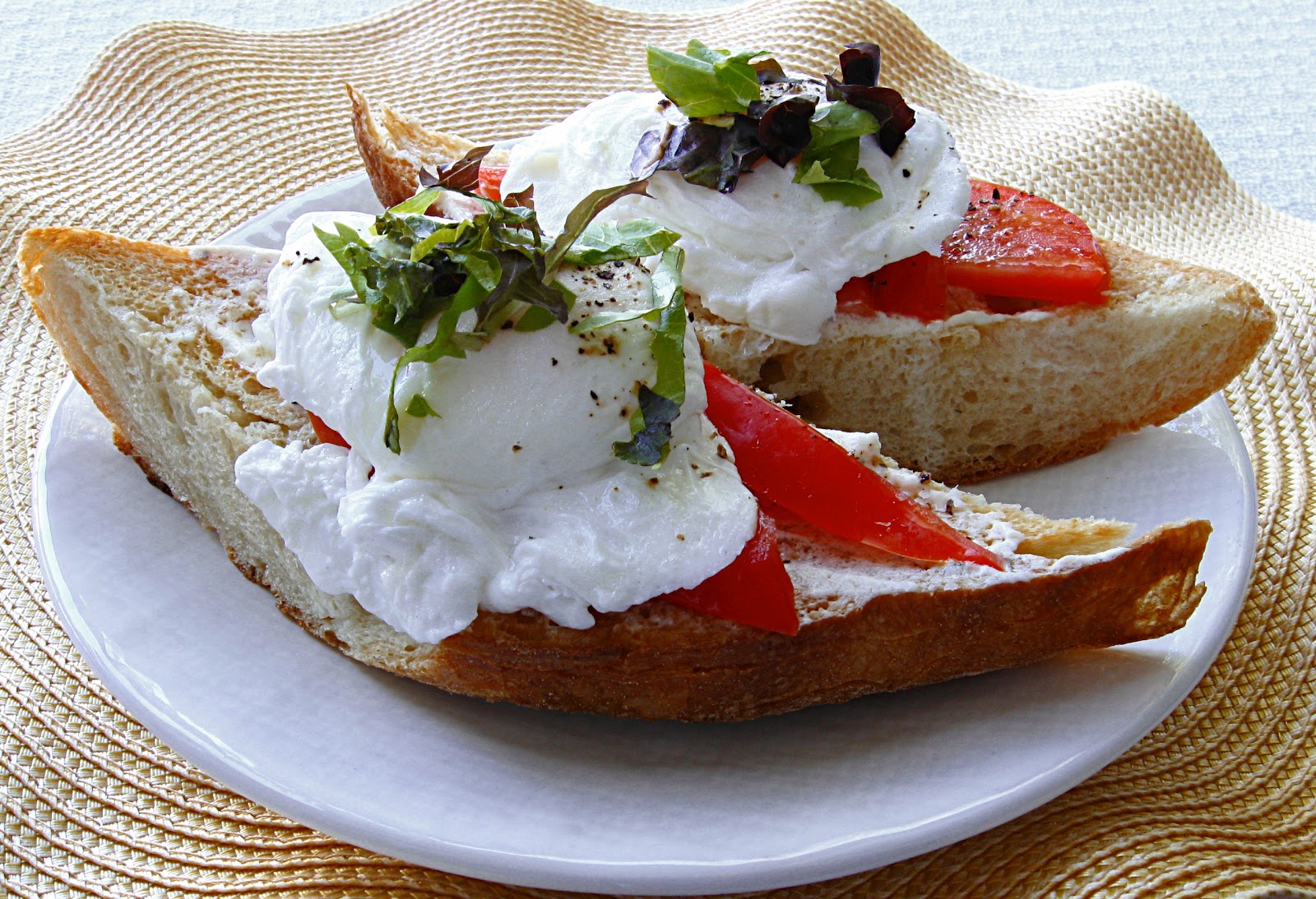 All That Splatters Poached Eggs on Toasted Baguette with Goat Cheese and BlackPepper Vinaigrette
