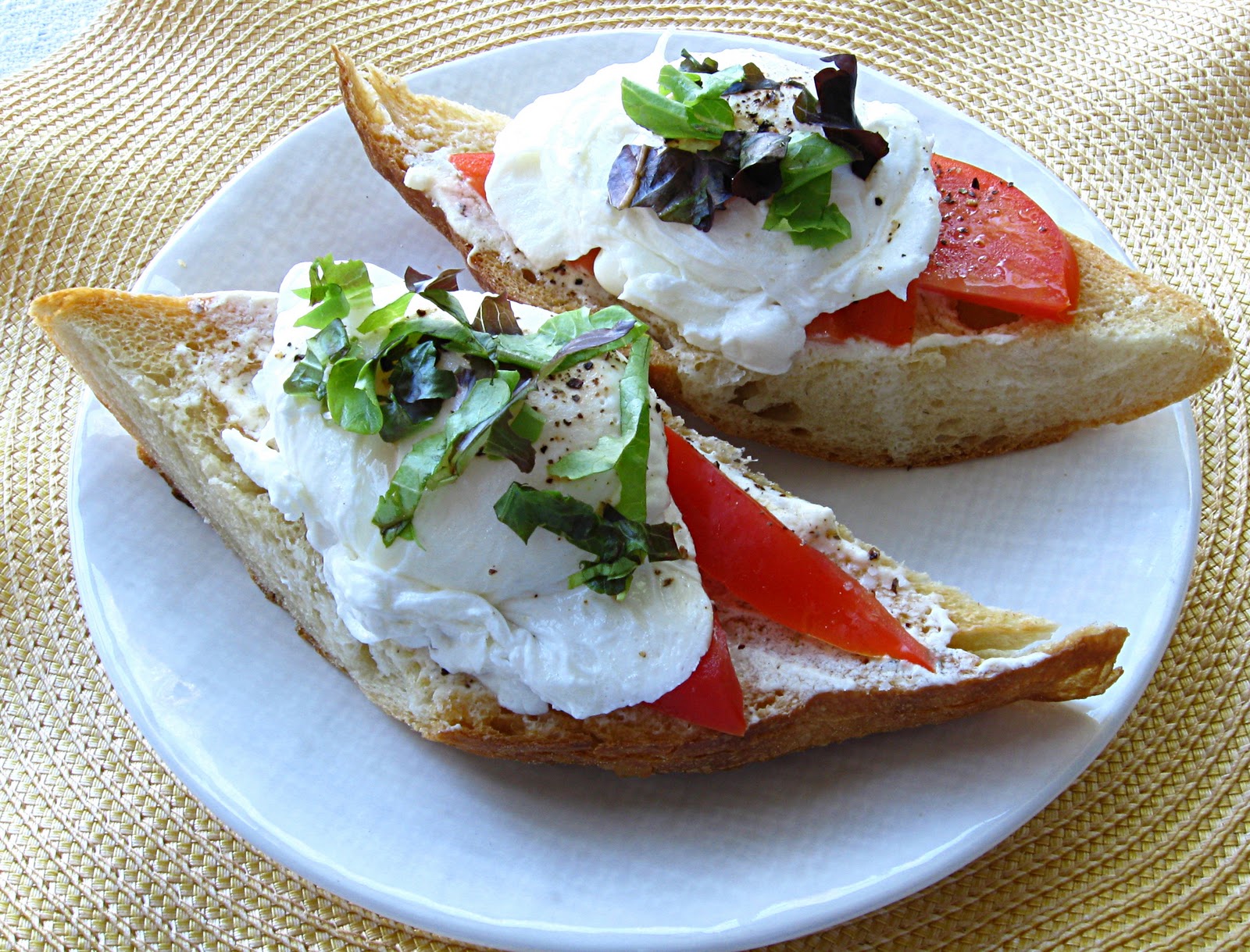All That Splatters Poached Eggs on Toasted Baguette with Goat Cheese and BlackPepper Vinaigrette
