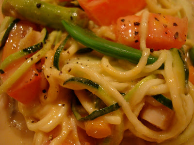 Close up of Zucchini Pasta with Mixed Vegetables & Peanut Sauce