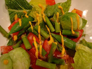 Greens with vegetables drizzle with mustard