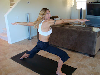 Woman doing Warrior II yoga pose