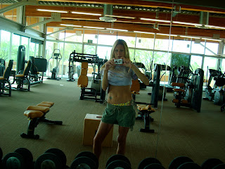 Woman in mirror wearing workout gear