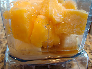 Side view of Mango Banana Vanilla Smoothie in blender