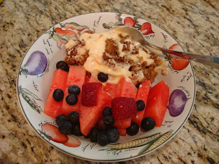 Bowl of watermelon blueberries yogurt and granola