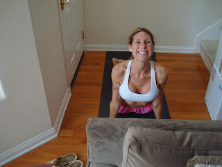 Woman smiling doing the up dog yoga pose