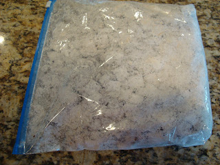 Chex and chocolate mixture in ziptop bag with powdered sugar